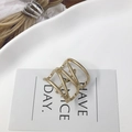 Minimalist golden multilayer wire wrapped ring on a decorative white ceramic tray - Hollow U-Shape Hook / Gold