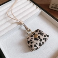 Close-up of leopard print mini bag pendant with silver clasp and brown woven strap - Coin Purse (52# Necklace)