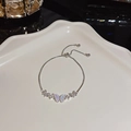 Silver bracelet with three butterfly charms featuring opal stones and small crystals - S321 Silver