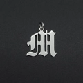 Detailed view of silver gothic letter M pendant in polished stainless steel for DIY jewelry - Letter M