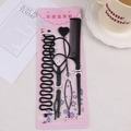 Five-piece black hair styling tool set with comb and bun makers on floral packaging - Centipede Braid 5-Piece Set