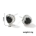 Detail view of heart stud earrings with black stone and cubic zirconia, 1.1cm x 1.0cm - Silver Frame / Black