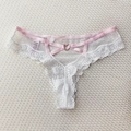 Lace thong with white polka dot mesh, pink waist straps, and a gold heart buckle - White