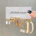 Detailed close-up of 6 pairs of gold-plated earrings with pearls and butterfly design - Gold Butterfly Pearl Style (5758401)