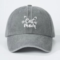 Close-up of Cat Mom embroidery and kitten whiskers on washed grey cotton baseball cap - Gray