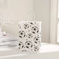 White football gift bag with black soccer and star prints for sports themed parties - Soccer and Five-Pointed Star