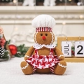Knuffel van peperkoekman met koksmuts en gestreepte short voor kerstversiering - Vrouwelijke Peperkoekman Pop