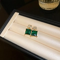 Macro detail of emerald green square stud earrings with white crystal accents in a box - Green Square Crystal Rhinestone Studs