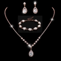 Detailed macro view of bridal jewelry set with pear-shaped cubic zirconia in rose gold - 463+796 3-Piece Set / Rose Gold