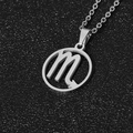 Silver stainless steel Scorpio zodiac necklace with round hollow pendant on black background - Scorpio / Steel