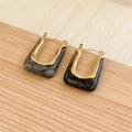 U-shaped gold earrings with grey marble resin inlay on a light wood background - 14k Light Gold Gray Marble (7845)