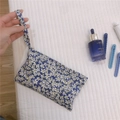 Detail of blue floral cotton mini bag with white flowers on quilted background - Klein Blue Floral