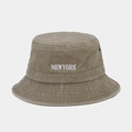 Close-up of vintage washed khaki cotton bucket hat with white NEWYORK embroidery detail - One Size / Khaki