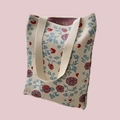 Detail of the high-quality knitted floral tote bag with blue and red patterns and texture - Red Blue Floral