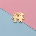 Polished gold boy and girl cartoon pendants with side loops on a pastel background - Boy Girl Gold 1
