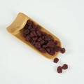 Realistic PVC dried cranberries display in a bamboo scoop for photography props - Dried Cranberries (500g)