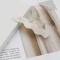 Iridescent pearl white wavy acetate hair clip with mother-of-pearl luster on stone base - Pearl White
