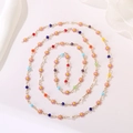 Spiral layout of colorful daisy bead necklace with gold chain and enamel flowers - Colorful Bead Daisy Mix Chain