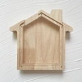 House-shaped oak wood money box with transparent acrylic panel and visible wood grain - Little House