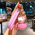 Pink Hello Kitty keychain featuring a coffee cup charm and embossed strap detail - Pink Cup Hello Kitty (B474-1) / Single Piece
