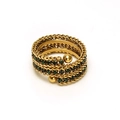Macro detail of 18k gold triple layered spiral ring with emerald green square zirconia - One Size / Green Zirconia