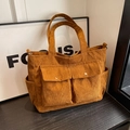 Ginger yellow corduroy tote bag with dual front flap pockets and vintage texture - Brown