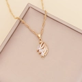 Golden feather necklace with white cubic zirconia crystals on a water-wave chain - Necklace / White