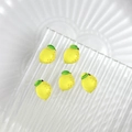 Five cute yellow resin lemon nail art charms with green leaves on glass tray - Lemon