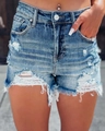 Detailed close-up of blue distressed denim shorts featuring ripped holes and frayed edges - S / Denim Blue
