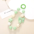 Green and white beaded phone charm with star and bow accents on a minimalist background - Phone Charm / Green Bowknot & Star (K486)