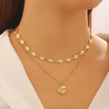 Detail of double-layer gold necklace with shell charms and white pearl on model - Scallop Pearl Pendant Necklace(S511)