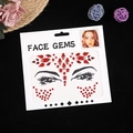 Gemme per il viso rosse simmetriche con strass a cuore su cartoncino bianco - Rosso