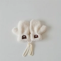 Close-up of white plush baby mittens featuring cute brown bear embroidery and string - One Size / Mittens / White