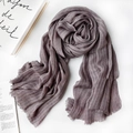Soft grey linen scarf with thin white stripes and fringed edges on a minimalist surface - 1477 Modal Taro Purple