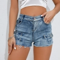 High-waisted blue denim shorts featuring side buckle details and frayed fringe hem - Blue