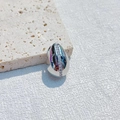 Silver teardrop pendant with diamond inlay on a minimalist stone base display - Vertical Stripe Style / Silver