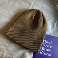 Deep brown knitted ribbed beanie hat in a classic minimalist retro style for autumn and winter - Elastic / Coffee