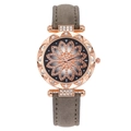 Detail of rose gold watch case with floral crystal dial and gray leather strap - Floral Art Dial Watch / Gray