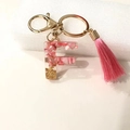 Pink resin initial F keychain with gold flakes, shell fragments and stylish tassel - Letter F