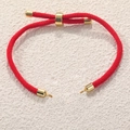 Adjustable red Milan cord bracelet with gold-plated metal accents on textured background - Red