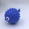 Blue squeeze puffer fish toy with soft cone spikes and large eyes for water play - Blue Bath Dolphin