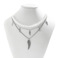 Detail of multi-layered necklace with white pearls and silver wing pendants on a bust - Silver