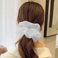 Elegant white organza oversized hair scrunchie shown on a ponytail hairstyle - White