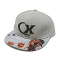 Detail of grey hip-hop cap featuring bold CX embroidery and street graffiti printed brim - M / Gray