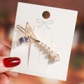 Detailed shot of mermaid tail hair clip with colorful crystals and white pearls - Colorful Mermaid Tail