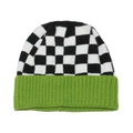 Detail of checkered knit beanie featuring black and white patterns with a neon green cuff - Green