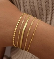 Set of 5 minimalist gold plated stainless steel bracelets in various link styles on wrist - Gold Flat Bead Tube Snake 5-Piece Set