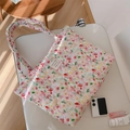 Detailed close-up of a floral quilted cotton tote bag featuring a decorative woven label - Pink Small Floral