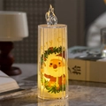 Dettaglio di candela LED Babbo Natale con luce calda su tavolo in marmo decor - Babbo Natale
