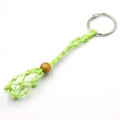 Neon green hand-woven net keychain with adjustable drawstring and wooden bead detail - Green